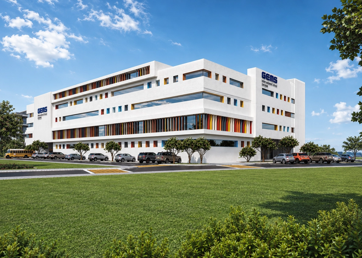 GEMS International School Zanzibar — front facade with colourful window mullions, school bus and open lawn