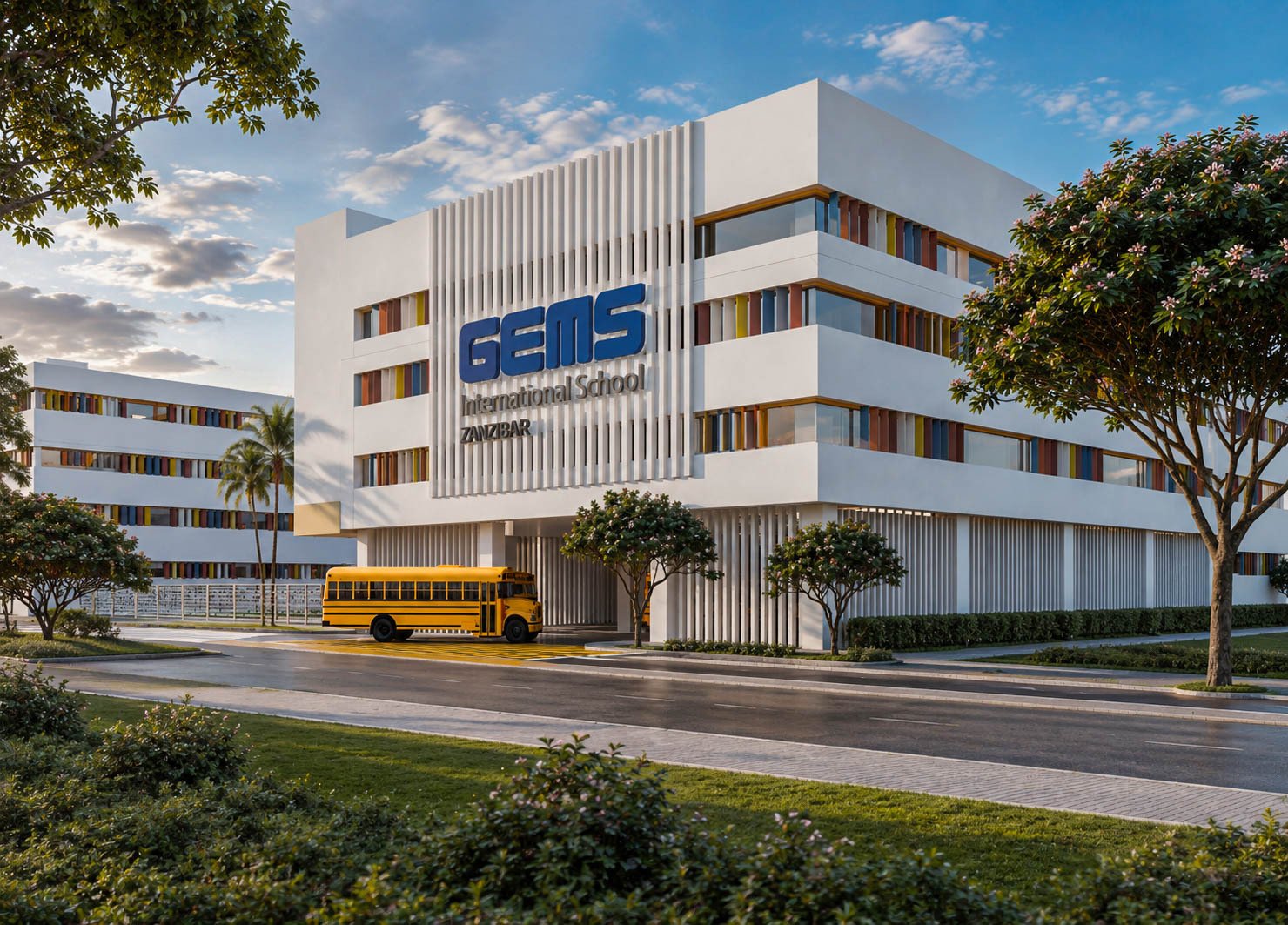 GEMS International School Zanzibar — angled view of the campus facade with school bus
